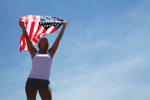 woman holding up an American flag 