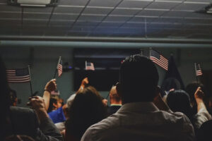 Immigrants holding US flags