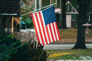 An American flag in front of a home