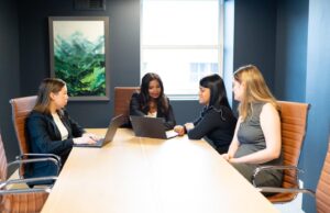 Four women in a conference room