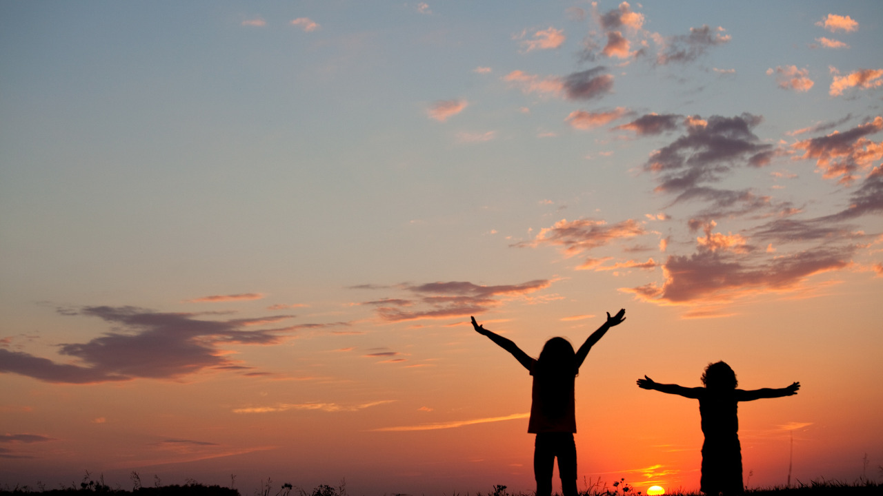 two kids watching sunset