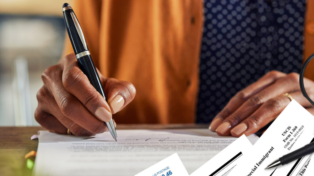 a woman signing a VAWA Declaration form